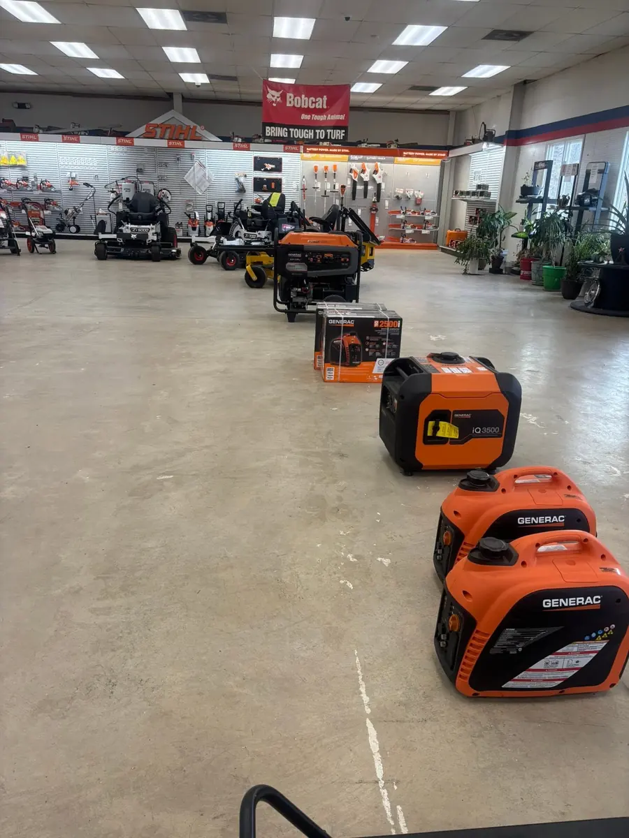 Showroom floor with Generac generators, zero-turn mowers, and STIHL displays